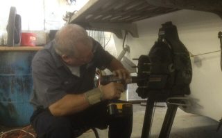 Kansas City Area Mechanic fixing boat
